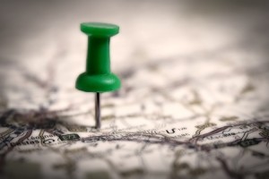 Thumbtack on a map symbol of travel destination