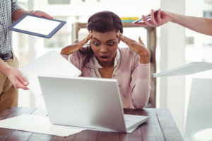 Businesswoman stressed out at work in casual office